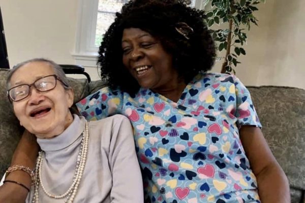 Memory care staff spends time with resident