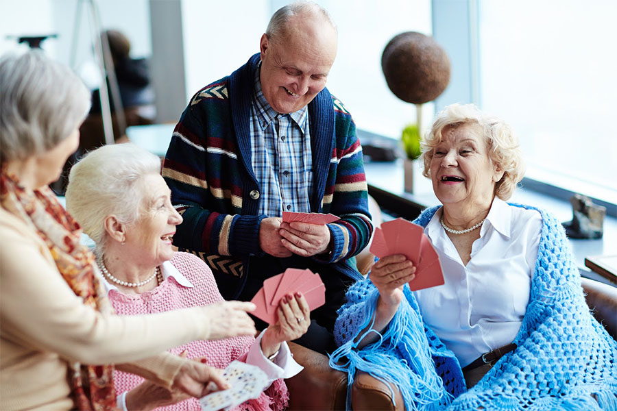 Residents thriving and engaging in activities in the right memory care community. An image representing what to expect from a memory care facility.