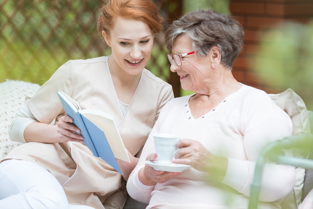 Reading for the elderly in Care taker reading for elderly