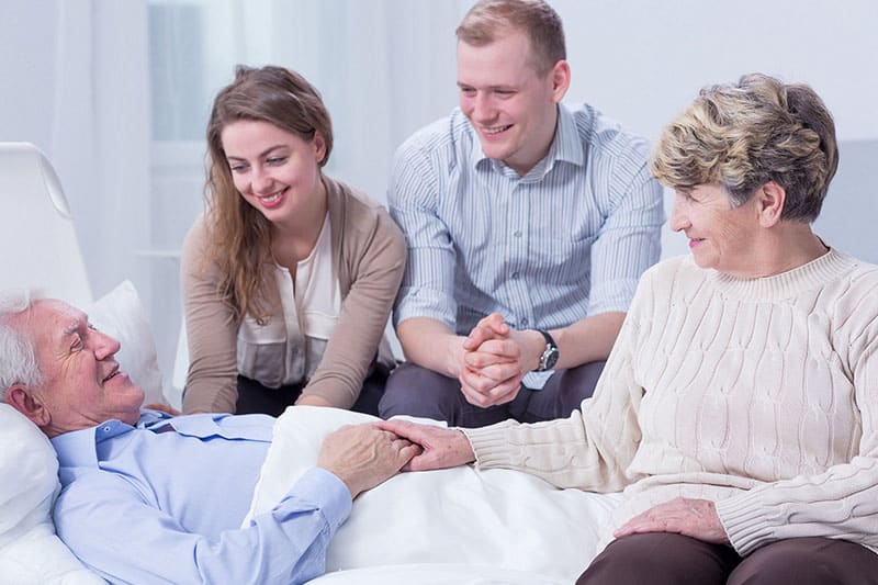 Family visiting their father at the Palliative care facility.