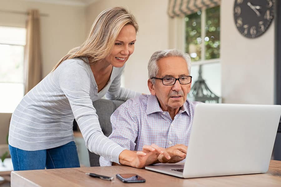 Daughter helping her father look for an assisted living community.