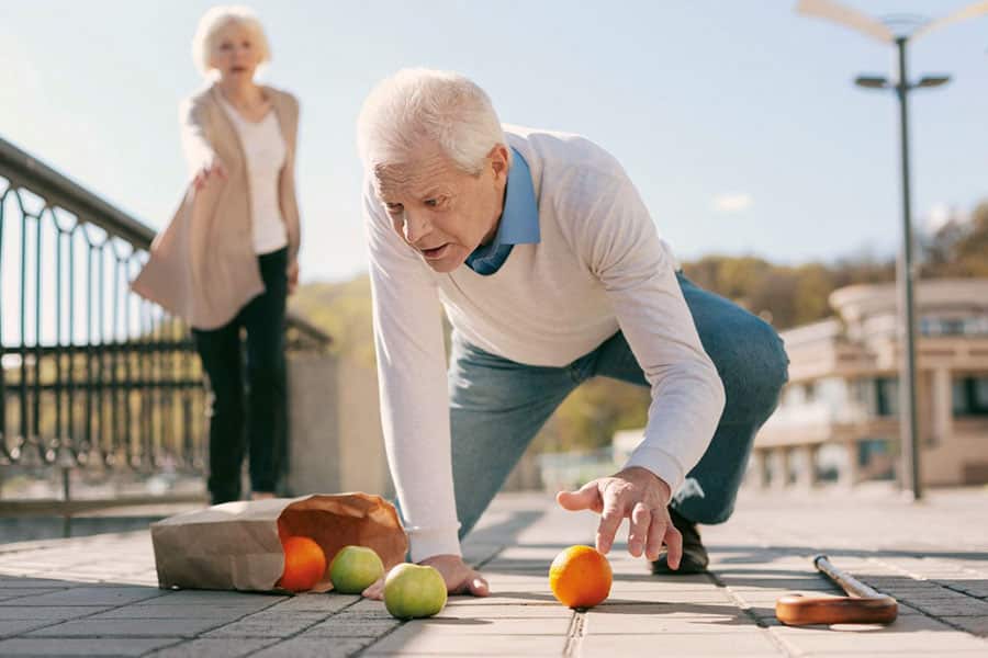 Senior adult man falling down. Showing signs that they need assisted living.