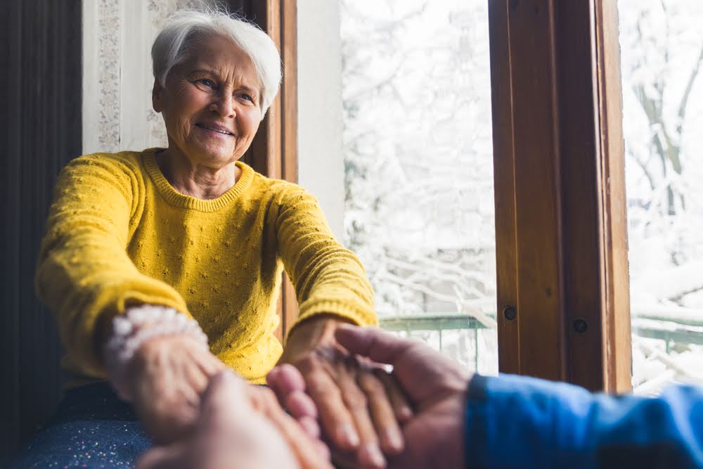 An-image-representing-family-visits-to-a-loved-one-in-an-MD-memory-care-facility Planned social activities 7 days a week, such as card games or art lessons