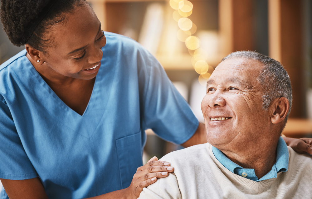 Help, support and medical with nurse and old man for retirement, rehabilitation or healing. Empathy, physical therapy and healthcare with patient and black woman in nursing home for caregiver service Planned social activities 7 days a week, such as card games or art lessons